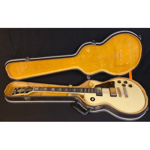 100 - Musical Instrument - a Custom CSL electric guitar, cased en suite, 20th century