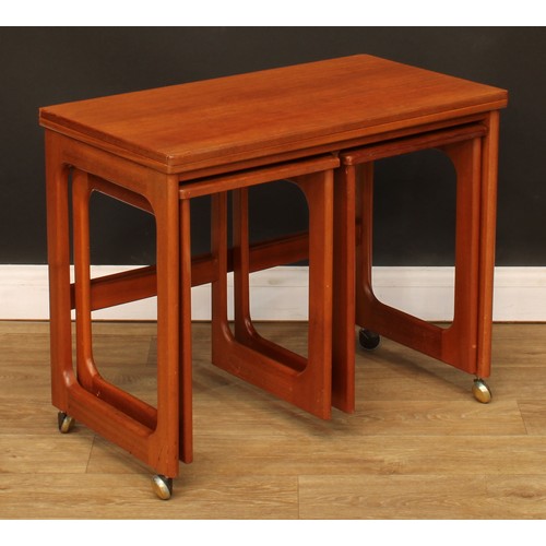 103 - Mid-century Design - a retro McIntosh Triform teak nest of tables, the largest 60cm high, 74.5cm wid... 