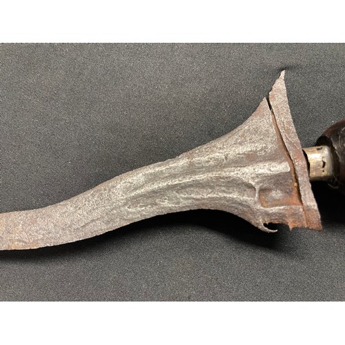3069 - A Javanese Kris with figural hardwood grip and serpentine blade 315mm in length, overall length 410m... 