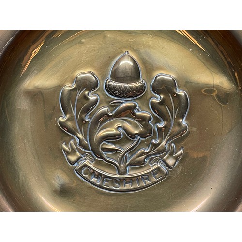 3187 - WW2 British Cheshire Regiment Trench Art comprising of a large brass platter embossed the the design... 