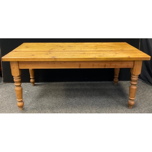 61 - A large country cottage plank-top pine kitchen table, rounded rectangular top, turned legs, 182cm lo... 