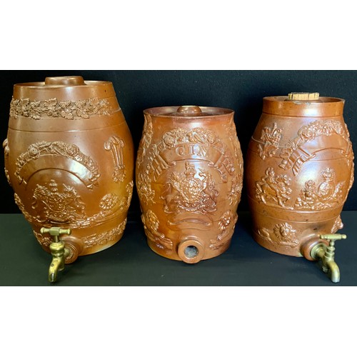 65 - A 19th century stoneware Gin barrel,  26.5cm high;  others relief decorated with lions, grape vines,... 