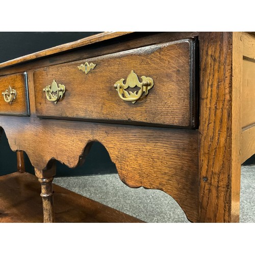 68 - A Titchmarsh and Goodwin 'Yeoman's' oak dresser base - South Wales leg dresser base, having a row of... 