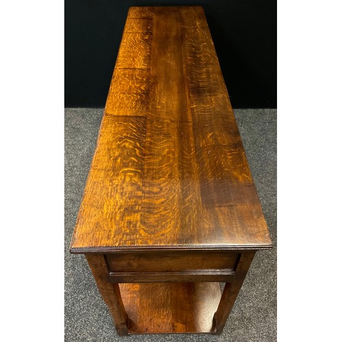 68 - A Titchmarsh and Goodwin 'Yeoman's' oak dresser base - South Wales leg dresser base, having a row of... 