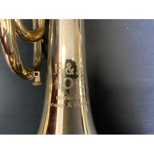 79 - A Boosey and Hawkes 400 brass cornet with plated mouth piece, 33cm long,  cased