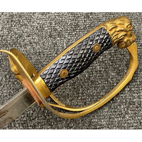 3251 - Spanish Army Officers Lion Head Sword with single edged fullered blade 760mm in length, marked 