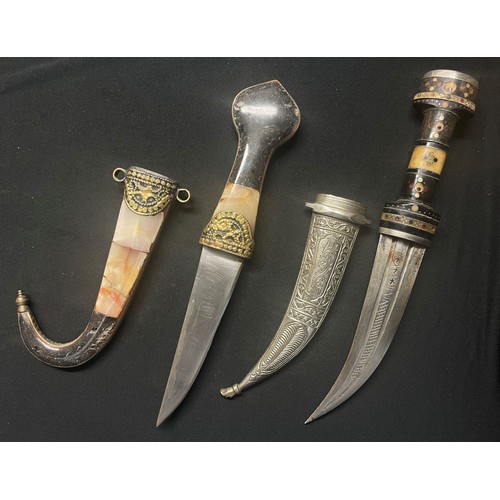 3270 - Pair of Jambiya daggers, one with 140mm long blade and stone inset grip and scabbard, the other with... 