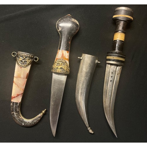 3270 - Pair of Jambiya daggers, one with 140mm long blade and stone inset grip and scabbard, the other with... 