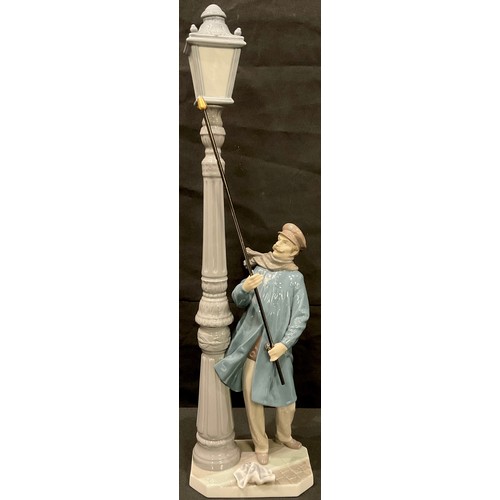 6 - A Lladro figure, The Lamp Lighter, 48cm, printed marks; three others smaller, Don Quixote, Sancho Pa... 