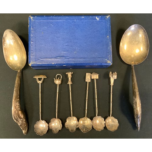 306 - A set of six silver coloured metal tea spoons, the tops terminating with rickshaws, kettle,  house e... 