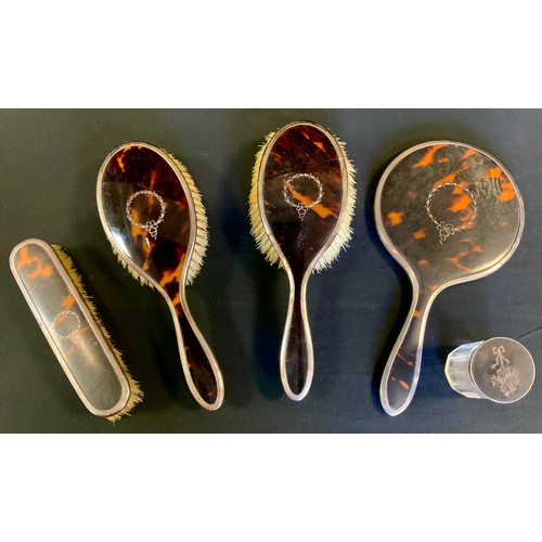 311 - A George V silver and tortoiseshell five piece dressing table set, Birmingham 1921