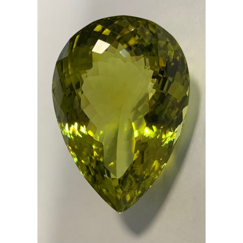 327 - Loose Gemstone - a natural green gold quartz, pear cut, 86.6ct, GLI  certificate