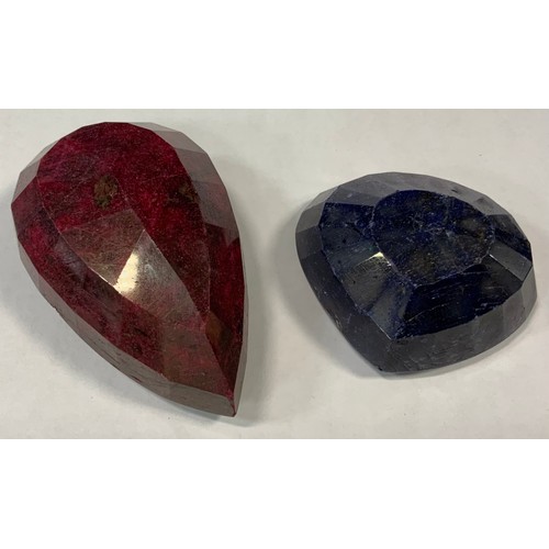 338 - Loose Gemstone - an extremely large natural ruby, pear cut, 911ct, GLI certificate;  another, natura... 