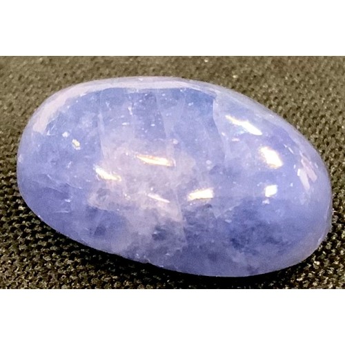 344 - Loose Gemstones - an oval cabochon cut tanzanite, 11.02ct,  IDT certificate