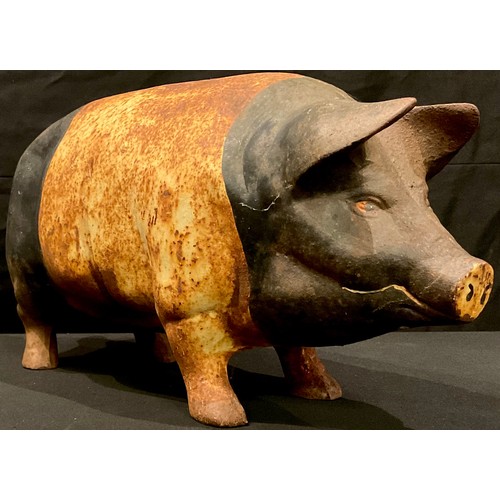 61 - A cast metal painted piggy bank, 46cm wide