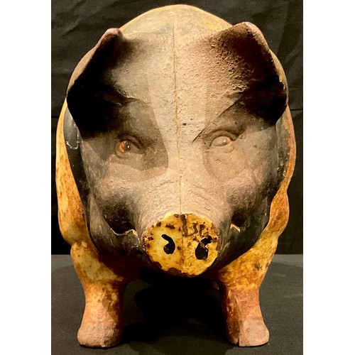 61 - A cast metal painted piggy bank, 46cm wide