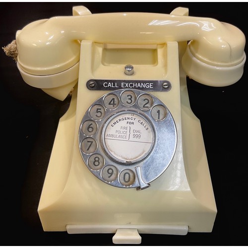 63 - A white Bakelite dial up telephone 