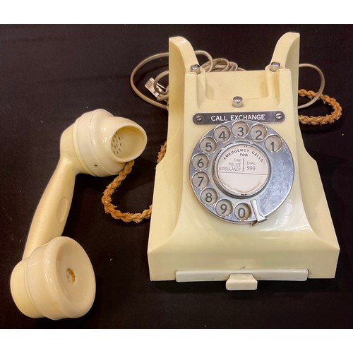 63 - A white Bakelite dial up telephone 