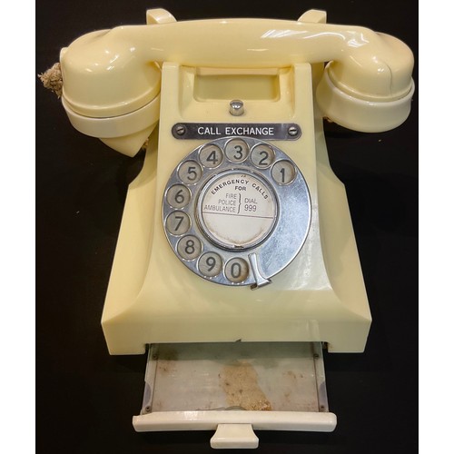 63 - A white Bakelite dial up telephone 