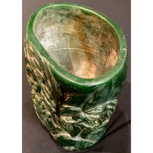 82 - A large contemporary Chinese carved green stone effect brush pot, decorated with figural landscape, ... 