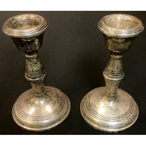 88 - A pair of Elizabeth II silver candlesticks, Birmingham 1963.