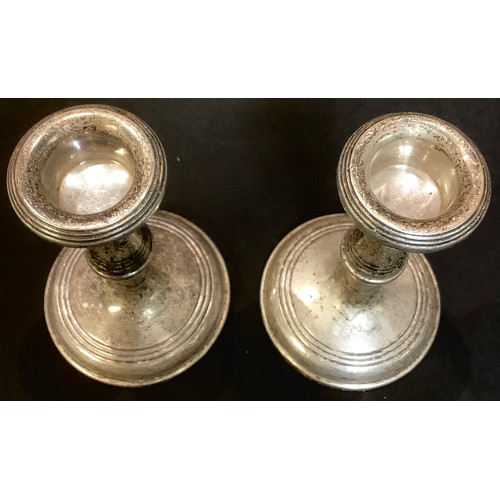 88 - A pair of Elizabeth II silver candlesticks, Birmingham 1963.