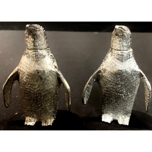 91 - A pair of plated novelty salt and pepper shakers, each modelled as a penguin, 7.5cm high