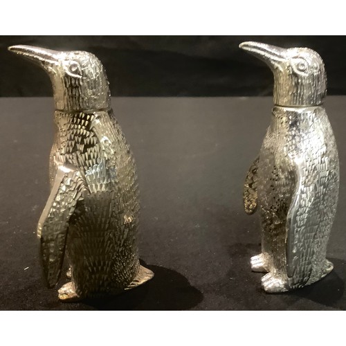 91 - A pair of plated novelty salt and pepper shakers, each modelled as a penguin, 7.5cm high