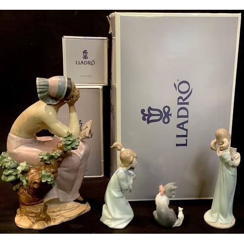 125 - A Lladro figure, Poetic Moment, boxed; others, Sleepy Kitten, boxed; Cat and Mouse, boxed; girl with... 