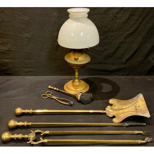 126 - A Hink's No. 2 brass oil lamp; a brass three piece fireside companion set; etc (6)