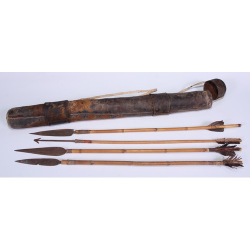 142 - Tribal Art - an African boran hide quiver and cover, enclosing four bamboo arrows, various shapes an... 