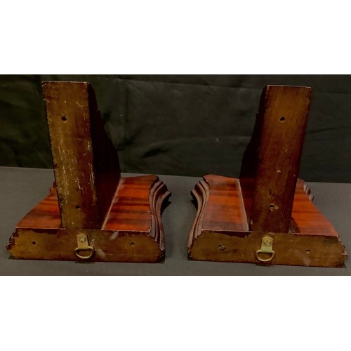 150 - A pair of mahogany wall brackets