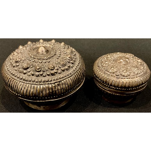 169 - A Tibetan/Nepalese silver coloured metal box and cover; another (2)