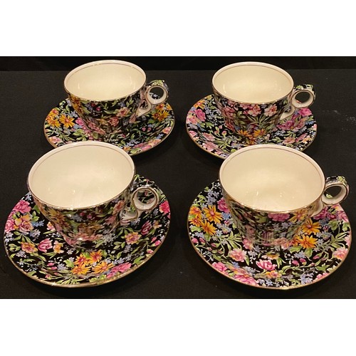 181 - A Grimwades Nantwich pattern chintz set of four teacups and saucers, printed marks, mid-20th century