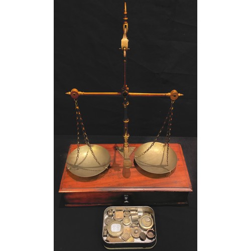 191 - A 19th century mahogany and brass apothecary balance scale and weights, c.1870