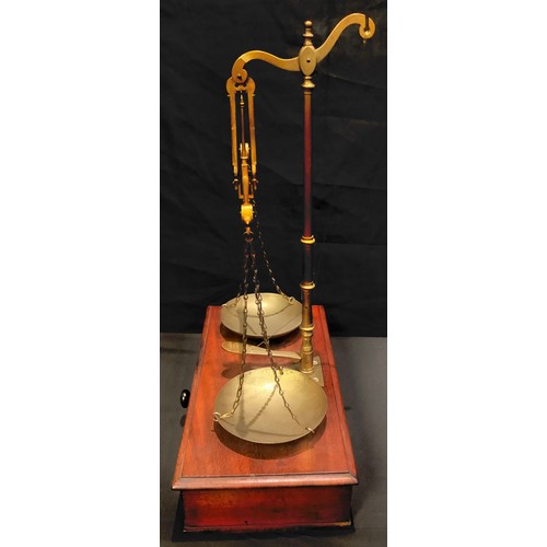 191 - A 19th century mahogany and brass apothecary balance scale and weights, c.1870