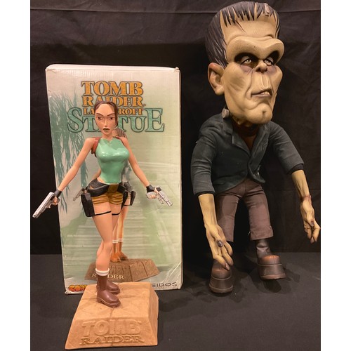 232 - A resin model of Tomb Raider's Lara Croft, 38cm, boxed; a novelty Frankenstein's Monster bendy limbe... 