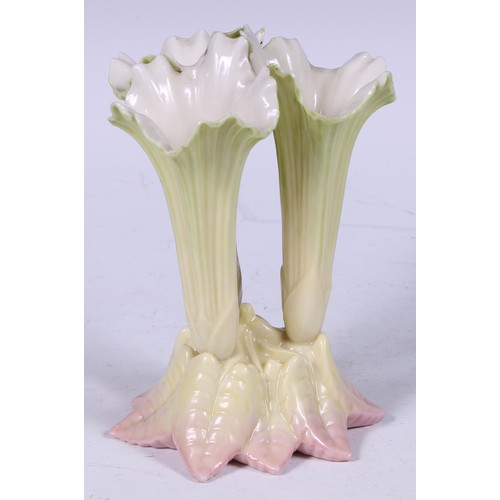 143 - An Edwardian Royal Worcester cluster spill vase, in the form of lily flowers, blush-tipped leaves, 1... 