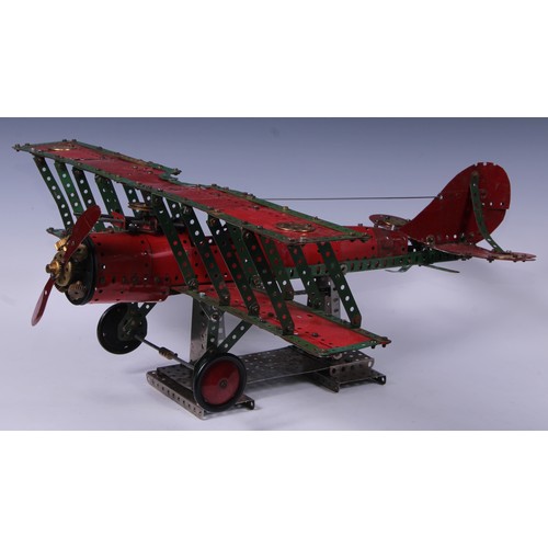 194 - Toys & Juvenalia - a Meccano biplane, possibly a shop display, 26cm high on stand, 65cm wingspan