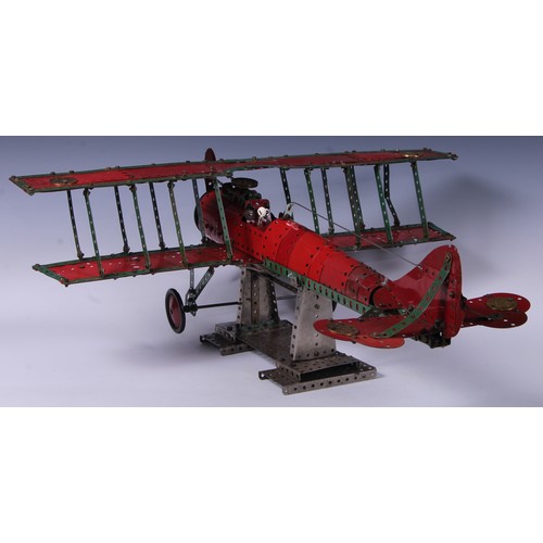 194 - Toys & Juvenalia - a Meccano biplane, possibly a shop display, 26cm high on stand, 65cm wingspan