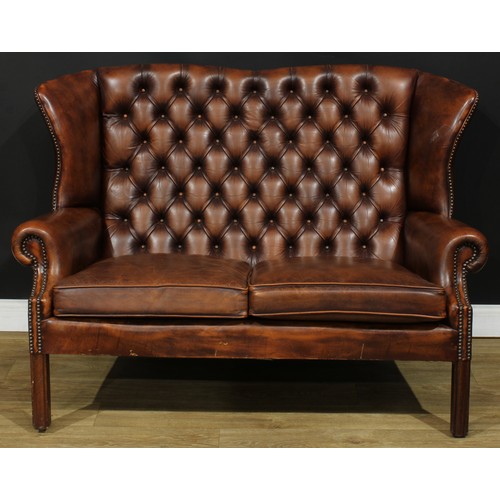 102 - An office reception Chesterfield double wing chair or sofa, 97cm high, 135.5cm wide, the seat 101cm ... 