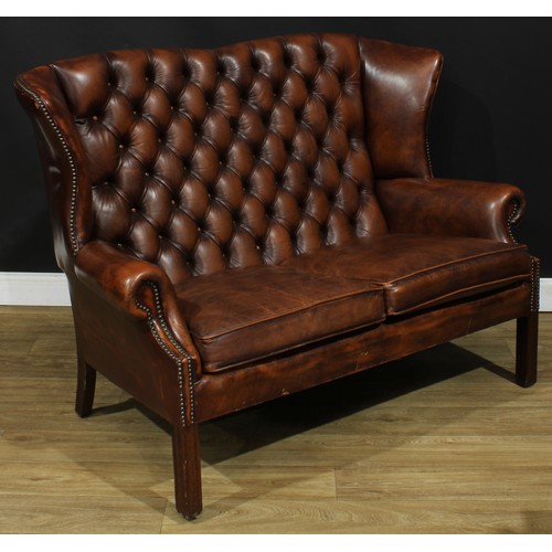 102 - An office reception Chesterfield double wing chair or sofa, 97cm high, 135.5cm wide, the seat 101cm ... 