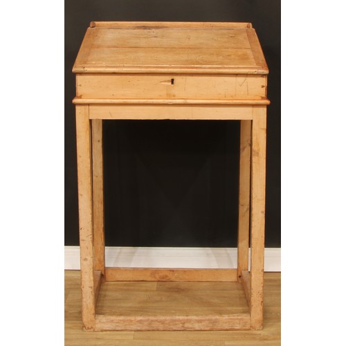 109 - A pine lectern or maître d' stand, hinged top with reading ledge, 123.5cm high, 76cm wide, 61cm deep