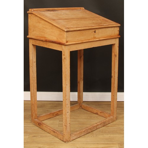 109 - A pine lectern or maître d' stand, hinged top with reading ledge, 123.5cm high, 76cm wide, 61cm deep