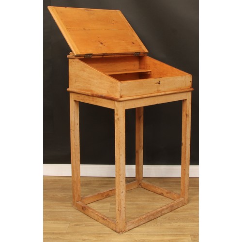 109 - A pine lectern or maître d' stand, hinged top with reading ledge, 123.5cm high, 76cm wide, 61cm deep