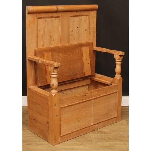 110 - A pine box settle or bench, two panel back, hinged seat, 124.5cm high, 91cm wide, the seat 76cm wide... 