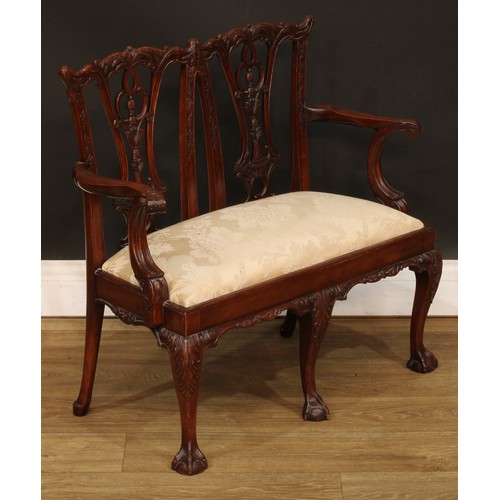 114 - Miniature Furniture - an Irish Chippendale design mahogany double chair back sofa, Cupid’s bow crest... 