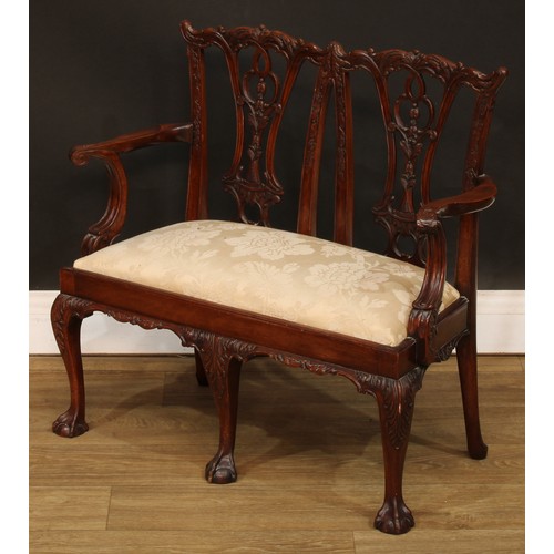 114 - Miniature Furniture - an Irish Chippendale design mahogany double chair back sofa, Cupid’s bow crest... 