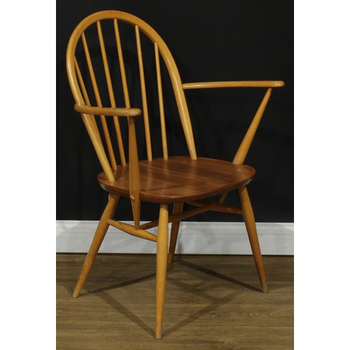 118 - Three Ercol Windsor arm chairs, the largest 88.5cm high, 66.5cm wide, the seat 41cm wide and 35cm de... 