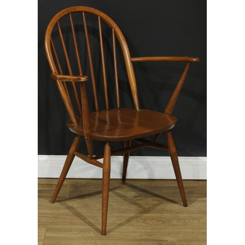 118 - Three Ercol Windsor arm chairs, the largest 88.5cm high, 66.5cm wide, the seat 41cm wide and 35cm de... 